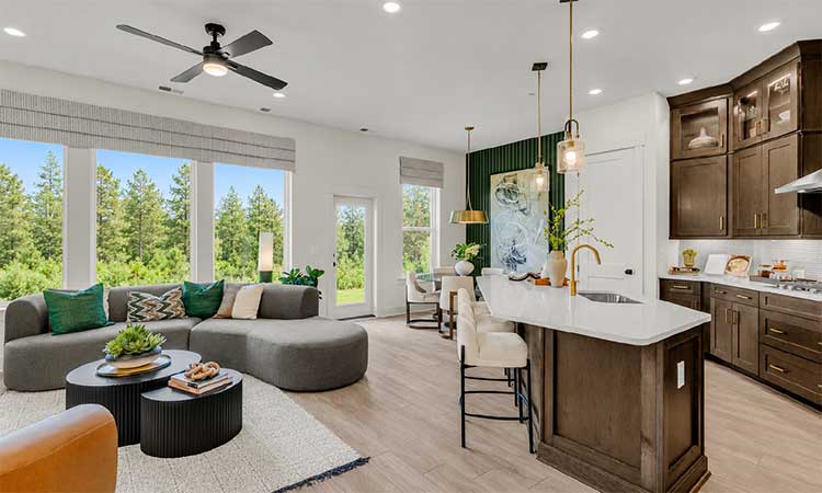 a photo of a kitchen, family room and dining space