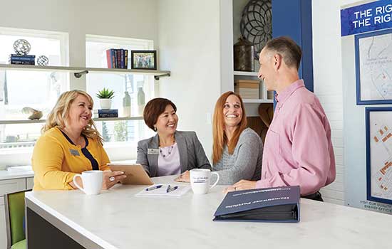 David Weekley Homes Home Team Members with Customer sitting at counter