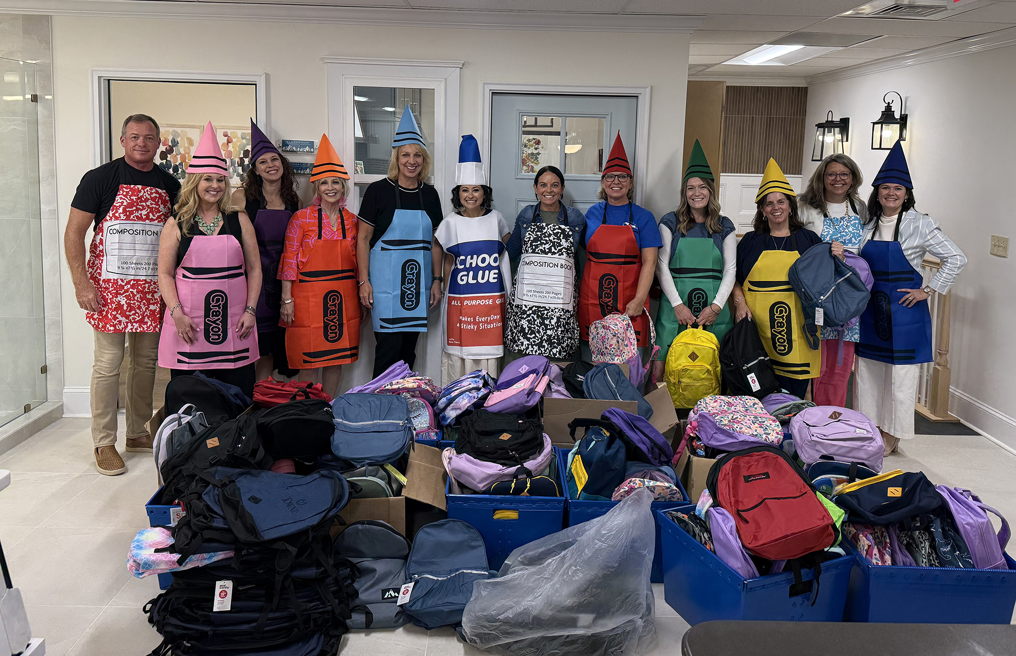 Members of the Charlotte Team donated 172 backpacks to The Harvest Center, Alexander Youth Network and the Charlotte Mecklenburg Dream Center.