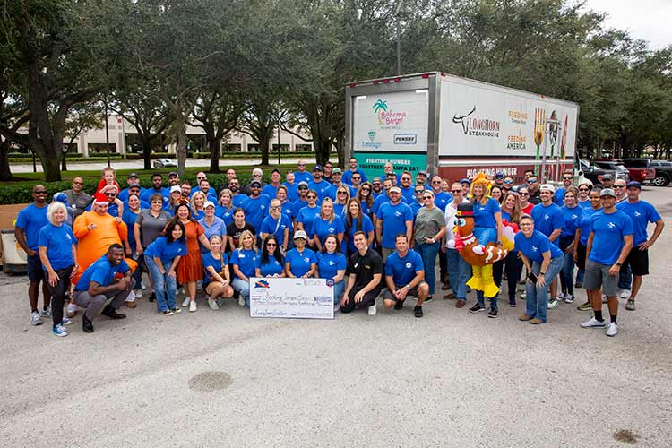 David Weekley Homes Team Members in Tampa collecting food for the annual Thanksgiving Food Drive