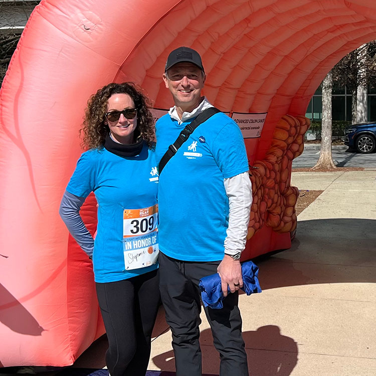 A David Weekley Homes Team Member in Austin at the finish line at a fun run