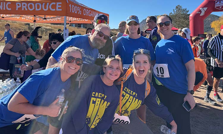 Team Members posing at a 5k benefit run