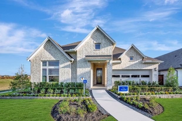 The Begonia model home from David Weekley Homes is available for tours daily in Meridiana 55’ Homesites.'