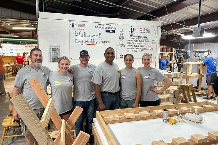 David Weekley Homes Team Members in Houston building beds for Sleep in Heavenly Peace